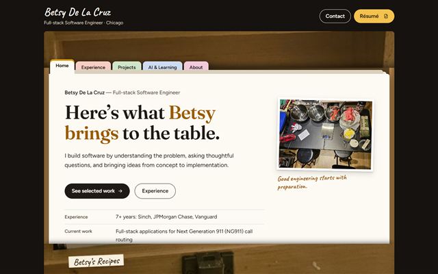 This website’s Home card, standing in Betsy’s open wooden recipe box: colored divider tabs for Home, Experience, Projects, AI & Learning and About, above the card and her photo of mixing bowls and a kitchen scale.